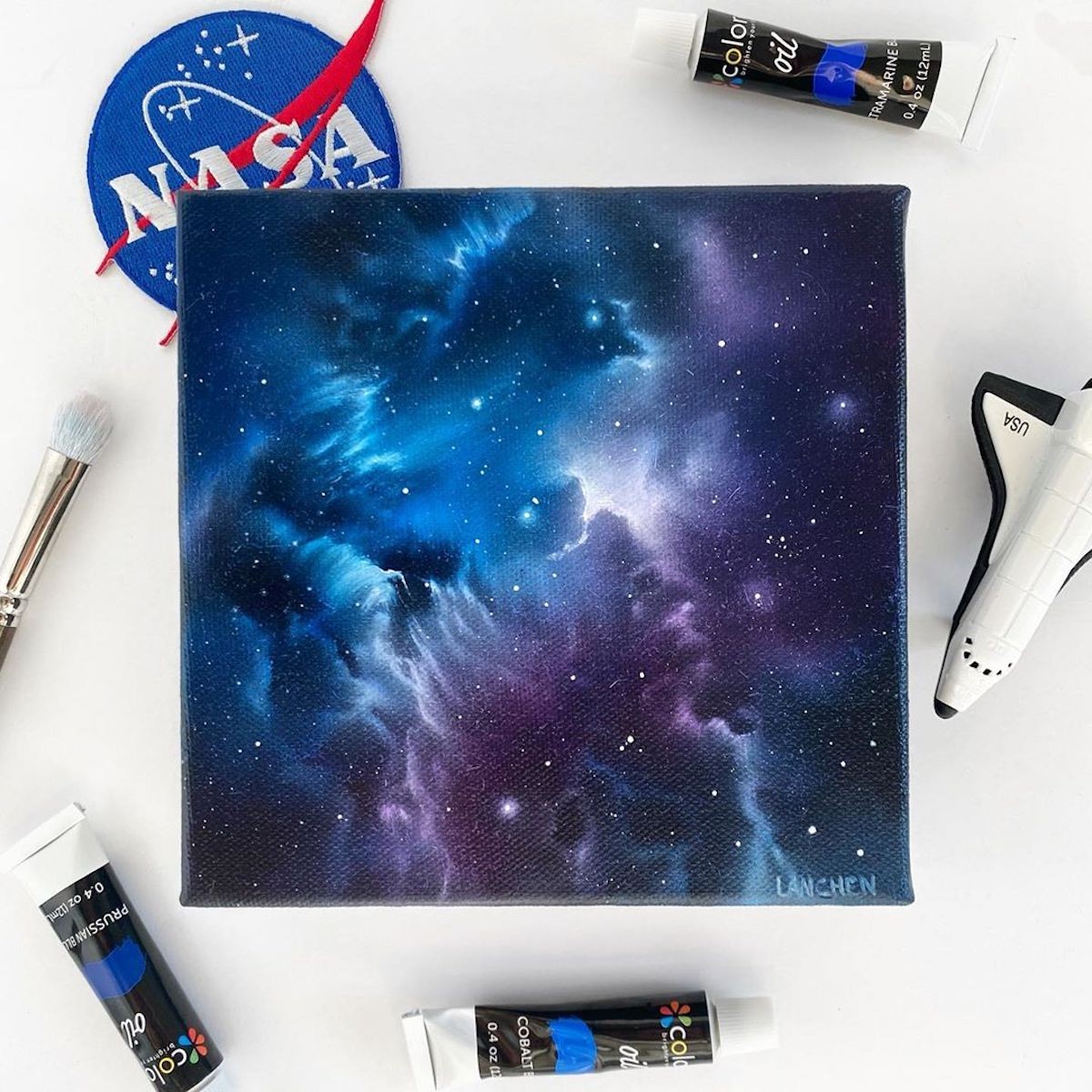 She uses acrylic paint to render scenes that are out of this world.