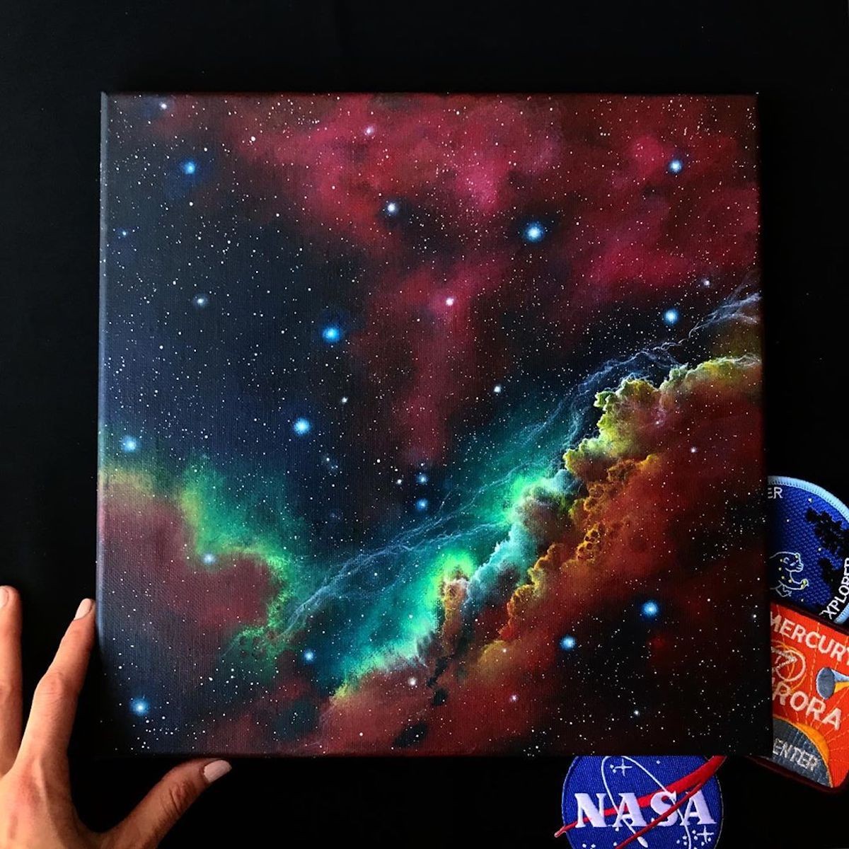 She uses acrylic paint to render scenes that are out of this world.