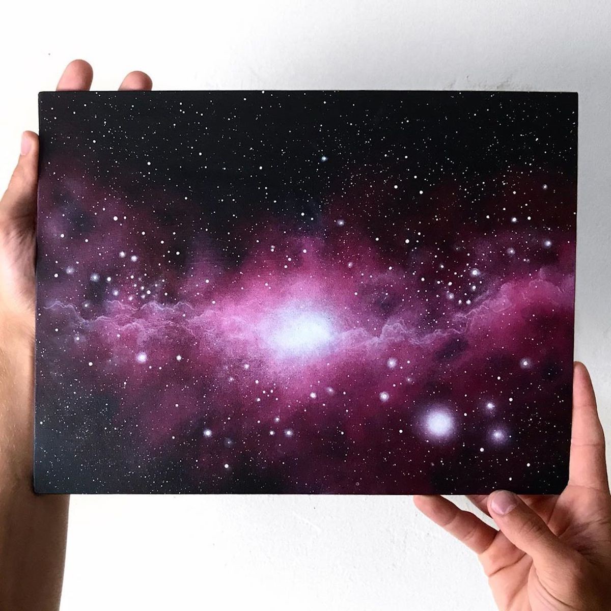 She uses acrylic paint to render scenes that are out of this world.