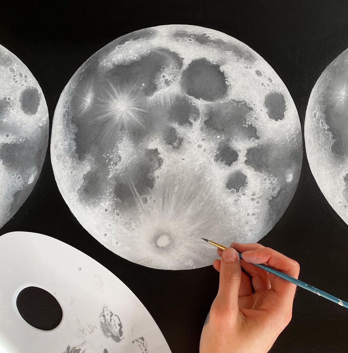 … and paints the different phases of the moon.