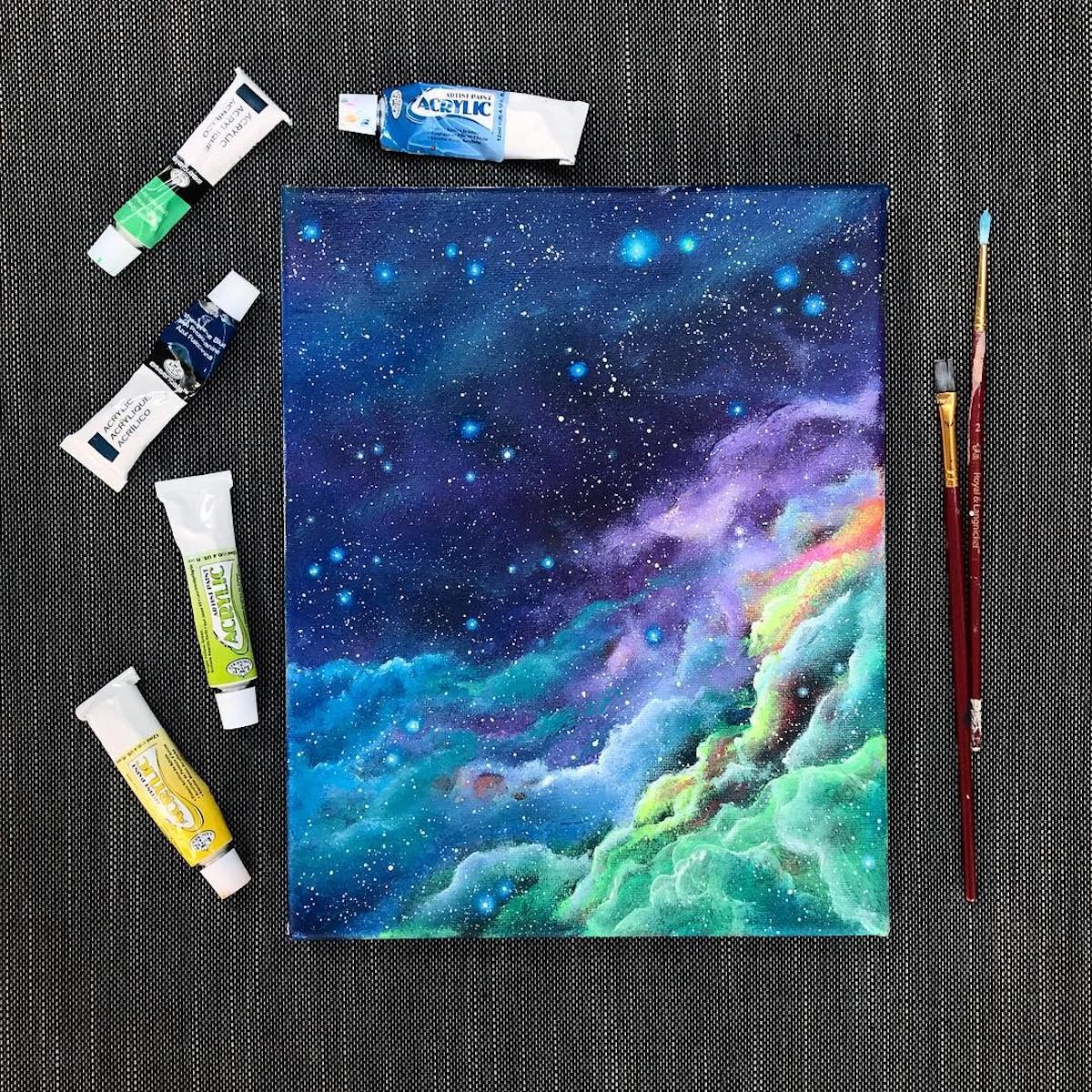 She uses acrylic paint to render scenes that are out of this world.